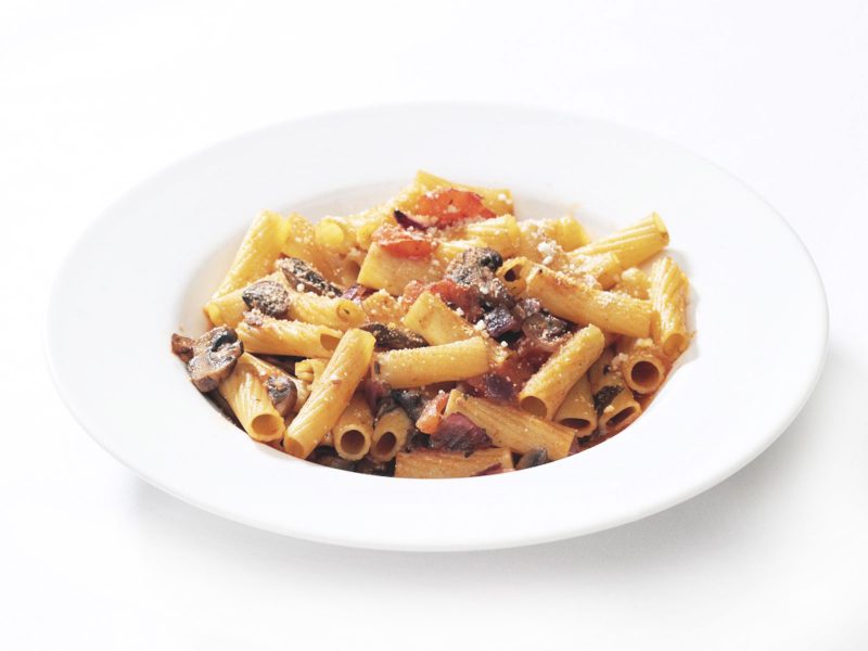 Rigatoni pasta in tomato sauce with aubergine, mozzarella and fresh basil